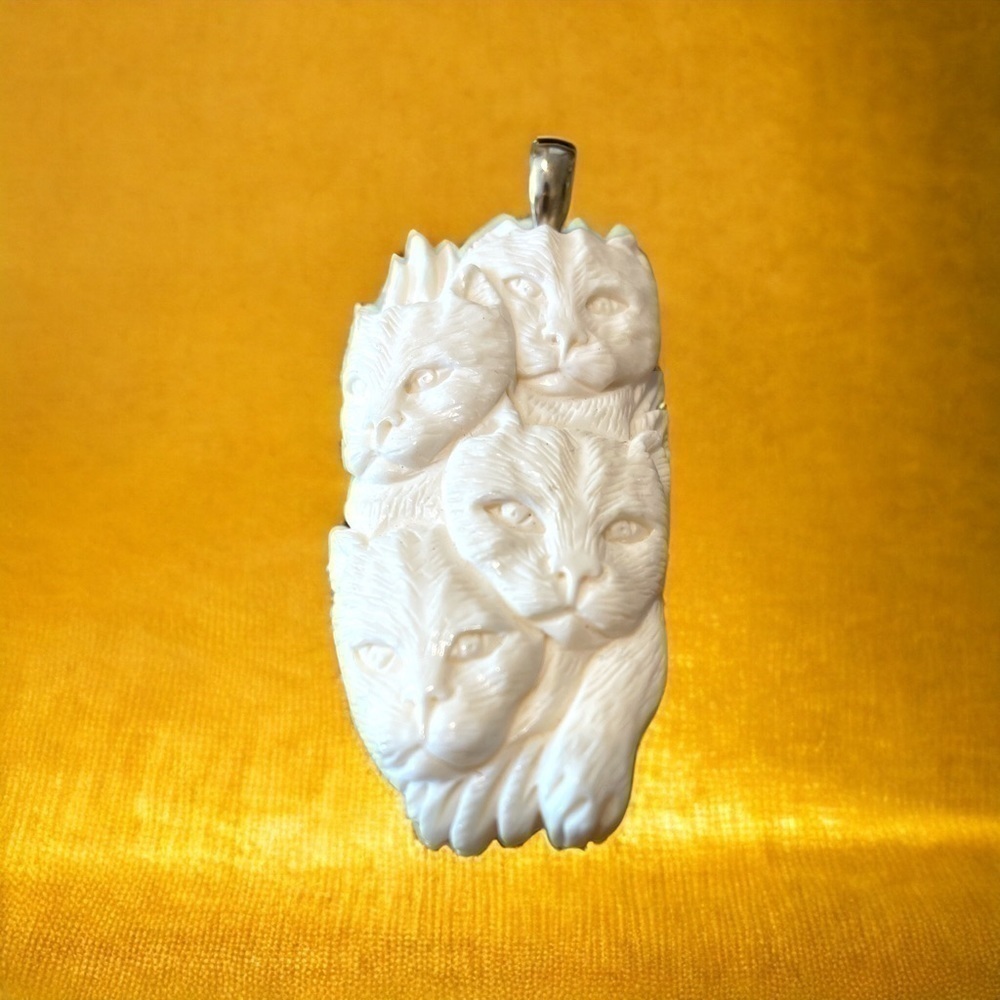NOVICA carved bone cat pendant with silver finding, no chain,excellent condition